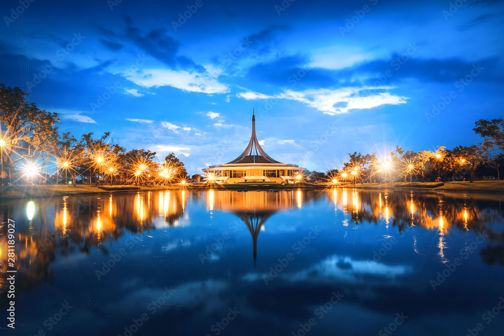 a beautiful view of Suan Luang Rama IX Park Bangkok, Thailand at night with water refection
