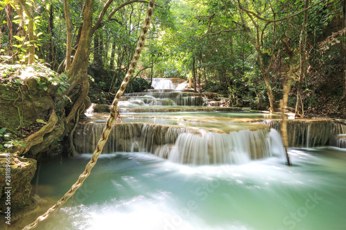 water fall in nature with green trees in Kanchanaburi, Thailand
