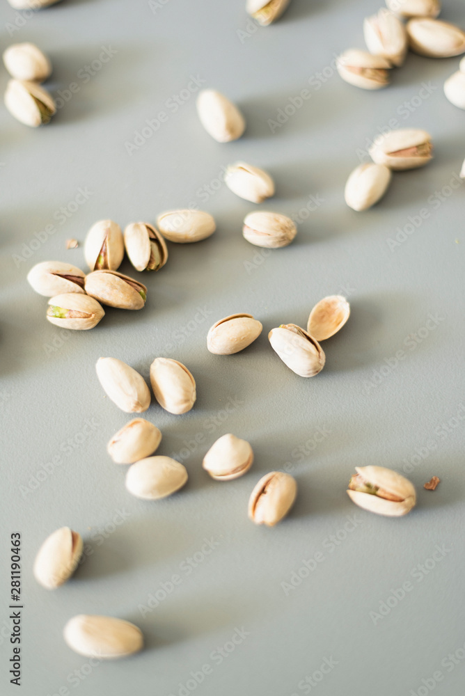 Pistachios scattered on the table. Pistachios scattered on the table.