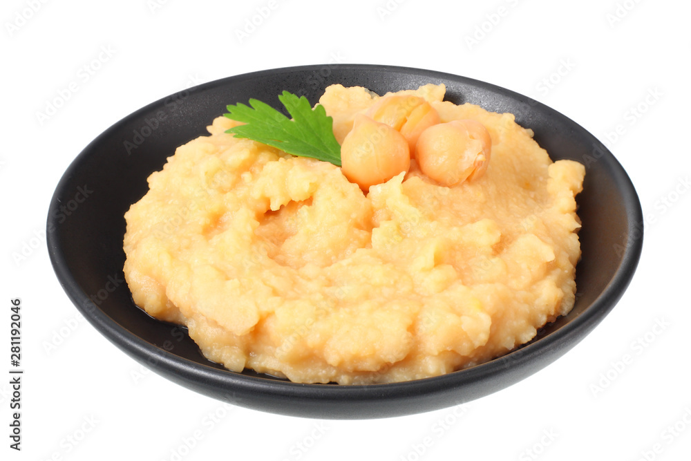 black bowl with chickpea hummus isolated on white background