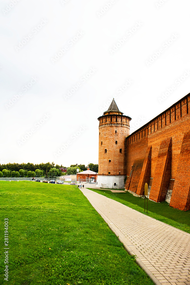 View on red brick wall and tower of Kolomna Kremlin, that was built in 1525-1531 by order of Tsar Vasily III. Russian history, sightseeing, ancient architecture. Vertical