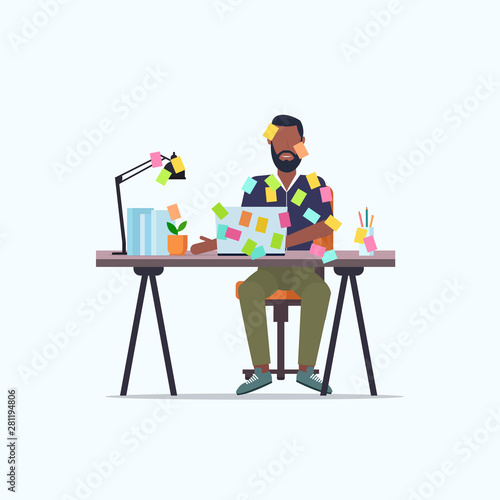 businessman covered with stick notes business planning deadline concept african american office worker using laptop sitting at workplace flat full length