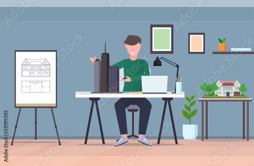 man architect using compass engineer drafting new building city model urban panning project concept housing contractor designing house plan draftsman studio interior horizontal full length