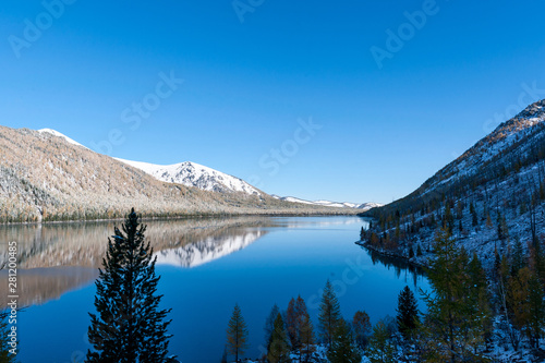 lake in the mountains. unruffled surface. winter