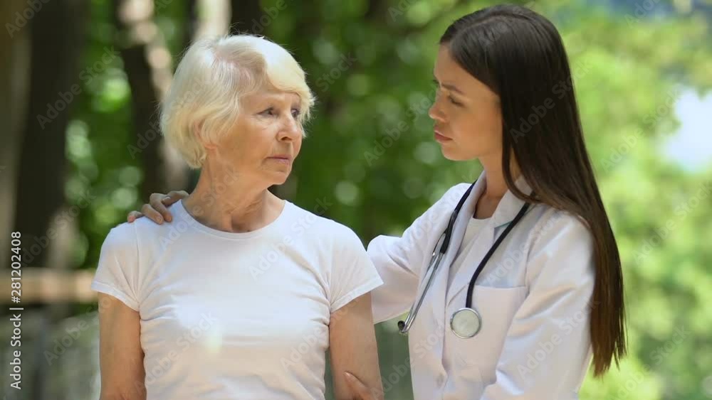 Concerned doctor supporting terminally ill patient, nursing home, medicare Concerned doctor supporting terminally ill patient, nursing home, medicare