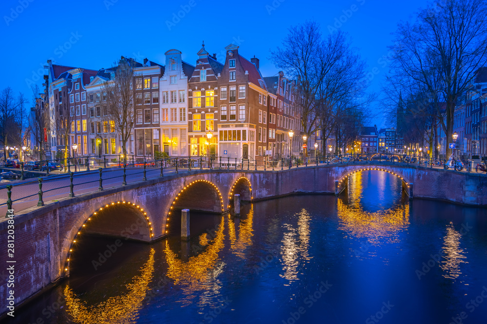 Dutch buildings in Amsterdam at night in Netherlands