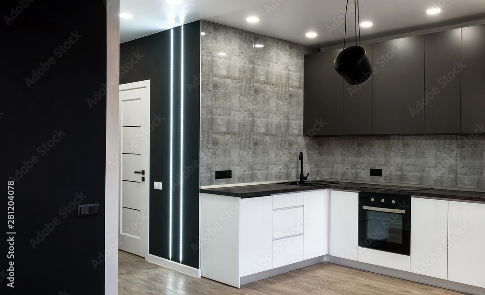New modern empty kitchen interior in white and gray colors, copy space. Kitchen appliances New modern empty kitchen interior in white and gray colors, copy space. Kitchen appliances