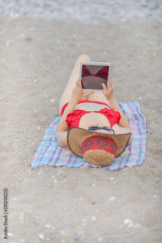 Girl in bikini sunbathing on the beach