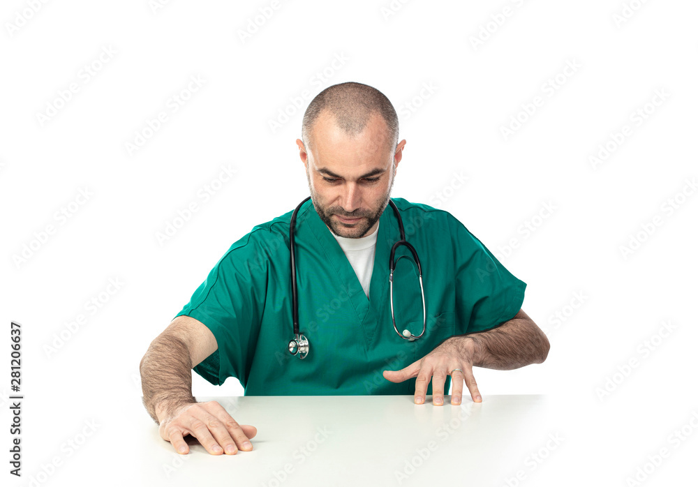 doctor moves his hands on a white table as if to simulate an action. doctor moves his hands on a white table as if to simulate an action.