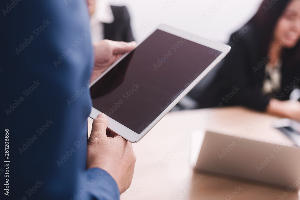 businessman working with tablet in seminar room
