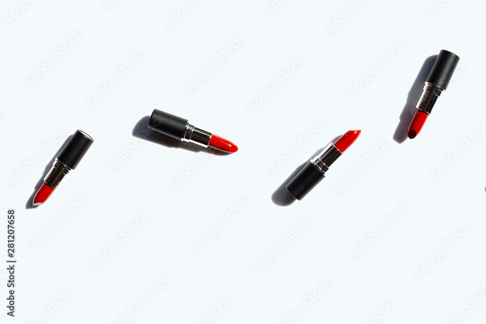 Flat lay composition, Lipsticks on white background with shadow. Beautiful Make-up concept Flat lay composition, Lipsticks on white background with shadow. Beautiful Make-up concept