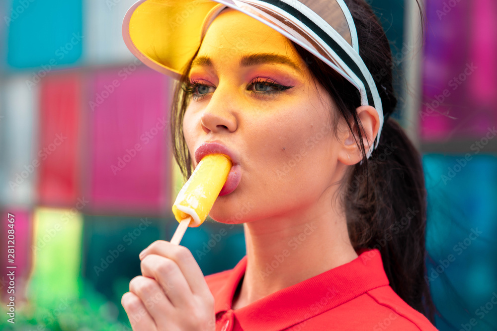 Young sexy brunette woman eating ice cream at sunny hot day. seductive  provocative woman Stock Photo | Adobe Stock