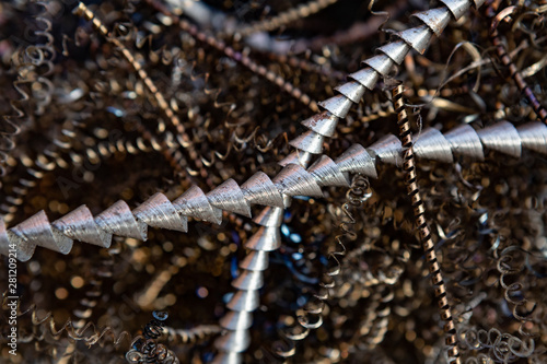 Close-up of twisted spiral steel shavings. Abstract background