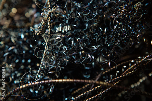 Close-up of twisted spiral steel shavings. Abstract background