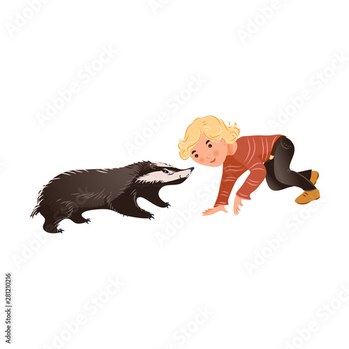 Cute wild forest badger is playing with blonde hair boy