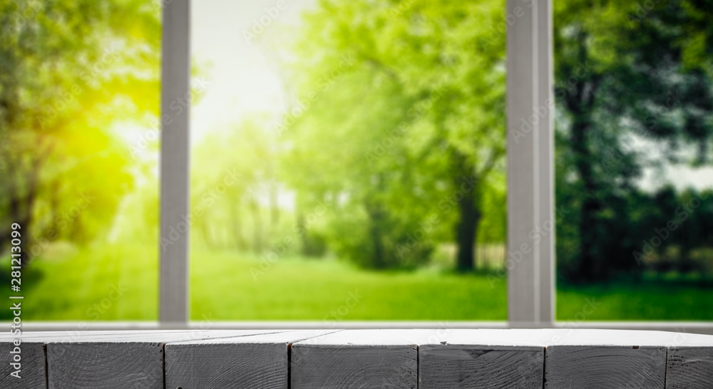 Fototapeta premium Table background with green garden view.