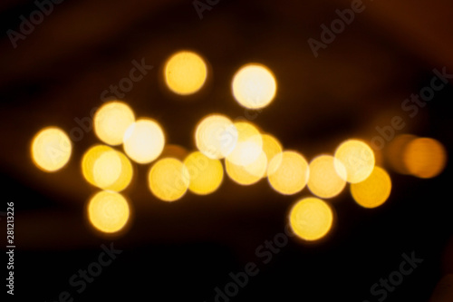 Abstract blurred and bokeh of reflection lighting of light bubs in the night time background.