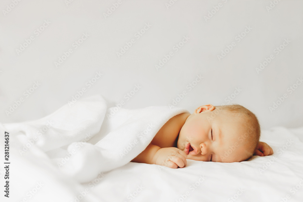 Baby sleeps on the bad. Baby sleeps on the bad.