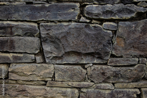 Natural old stones wall background brown color