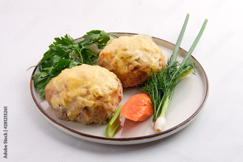 Cutlet covered with melted cheese served with fresh carrot, spring onion and parsey