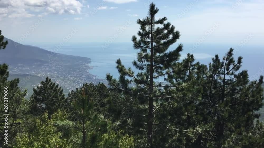 Wonderful panoramic view on sea, valley and coastal town from huge mountain covered wood. Beautiful nature seascape and mountainside landscape with woods. Sunny and cloudy summer weather. Wonderful panoramic view on sea, valley and coastal town from huge mountain covered wood. Beautiful nature seascape and mountainside landscape with woods. Sunny and cloudy summer weather.