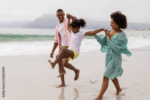 Family having fun together on the beach