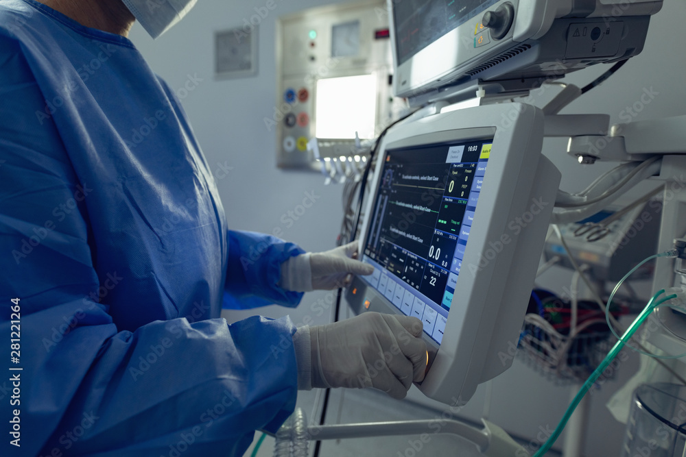 Surgeon using the medical monitor in operation theater at hospital Surgeon using the medical monitor in operation theater at hospital