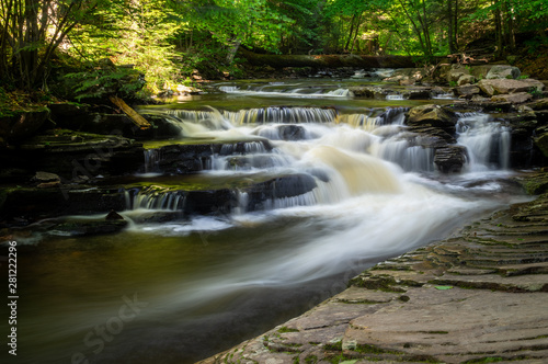 Fototapeta Naklejka Na Ścianę i Meble -  Gentle Waterfalls on Creek