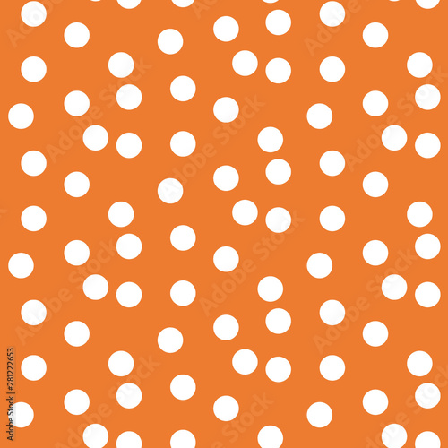 Orange background scattered dots polka seamless pattern