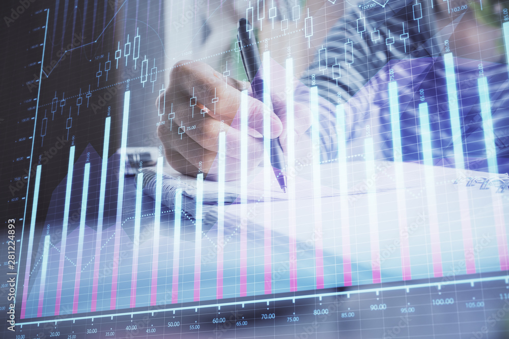 Financial forex graph drawn over hands taking notes background. Concept of research. Double exposure Financial forex graph drawn over hands taking notes background. Concept of research. Double exposure