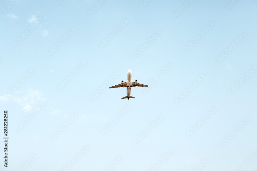Airplane flying in blue sky. Travel, vacation and holiday concept. Airplane flying in blue sky. Travel, vacation and holiday concept.