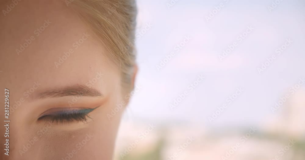 Vidéo Stock Closeup half face portrait of young cute caucasian female ...