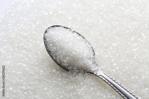 Closeup of spoon with white sugar