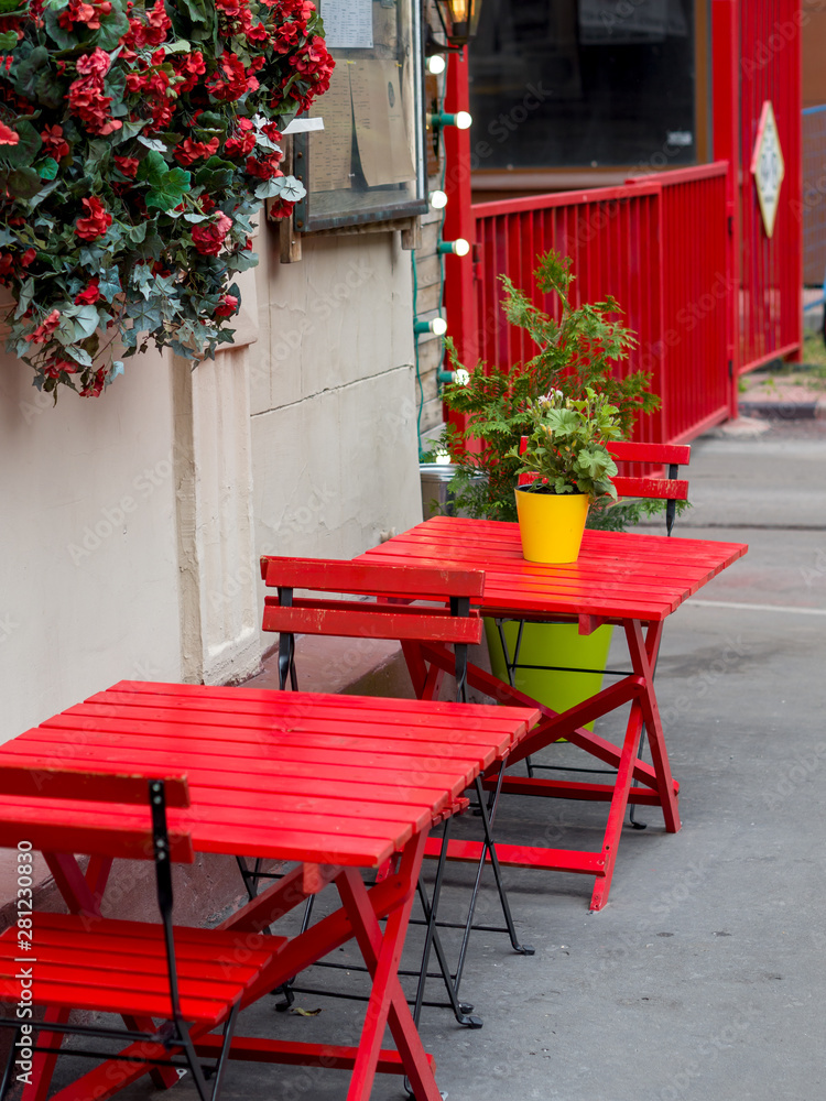 Red table and chairs in local cafe in Moscow