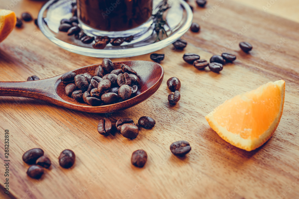 Coffee and orange with coffee bean on wooden background Coffee and orange with coffee bean on wooden background
