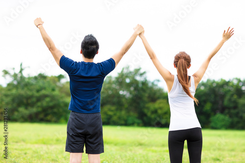 young couple fitness training together outdoors