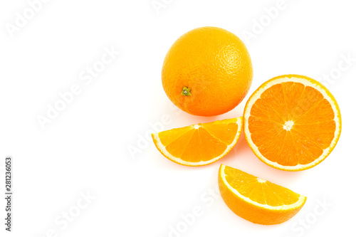 Orange is a fruit that contains vitamins. C. high in orange  cut in half With a shadow on a white background