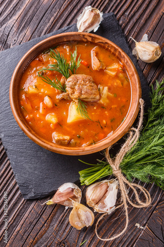 Chanahi a traditional Georgian meat stew in a bowl on stoyn board photo