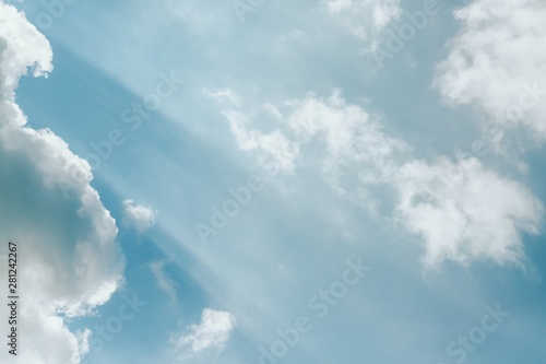 Beautiful white fluffy clouds on a sky background. Sunlight, light and shadow. Toned