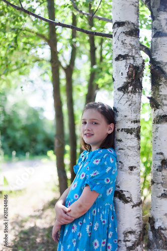  Portrait of   Russian little girl near birch.