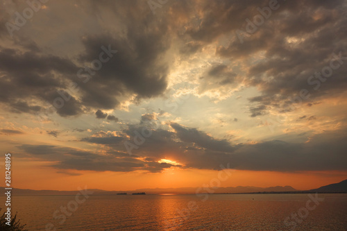Beautiful sunset with clouds over the Aegean sea
