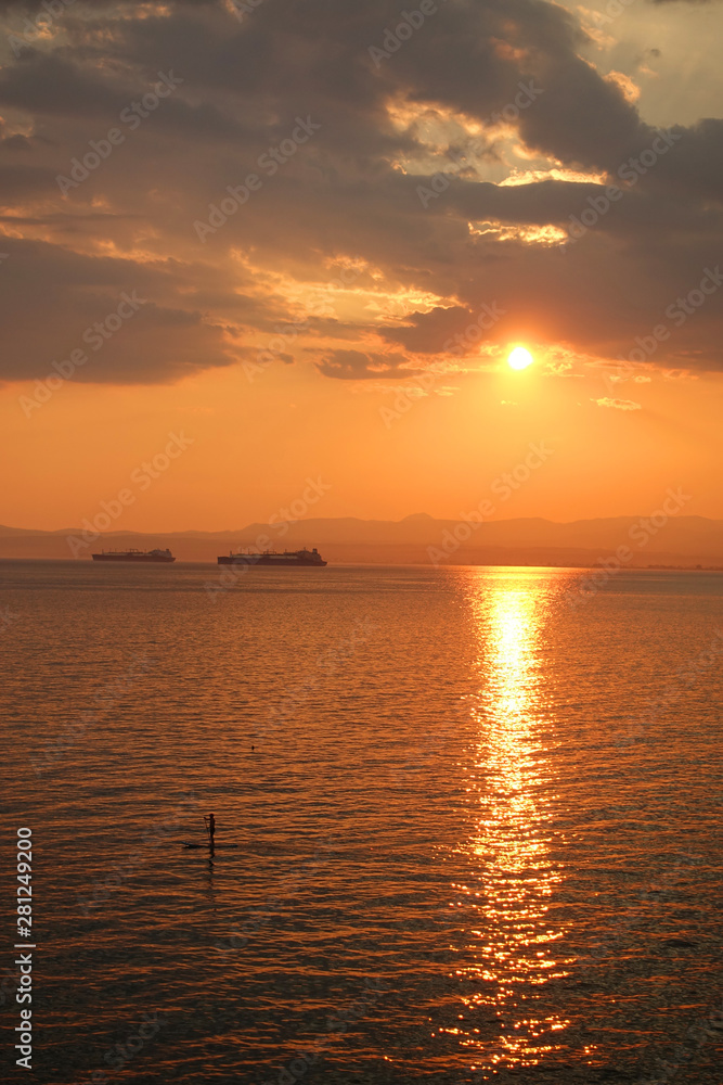 Beautiful sunset with clouds over the Aegean sea