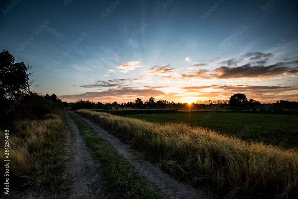 Fototapeta premium sunset on the road in countryside thailand