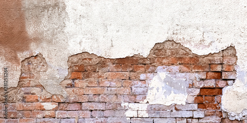 Background Of Old Vintage Dirty Brick Wall With Peeling Plaster, Texture. Shabby Building Facade With Damaged Plaster. Abstract Web Banner. Copy Space.