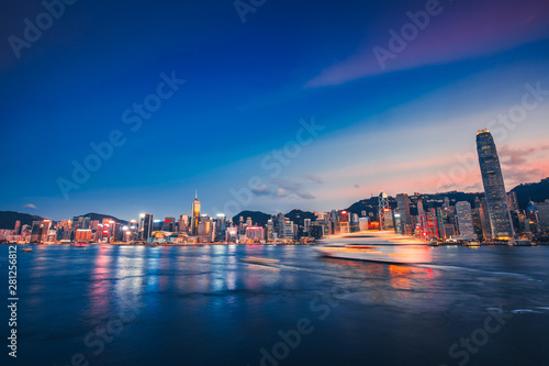 Hong Kong cityscape with cruise ship in Victoria Harbor photo