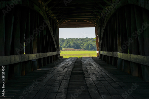 Looking through a covered bridge to the farm beyond  in Parke County  Indiana