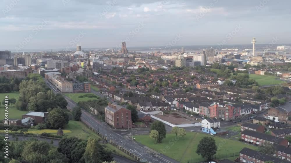 Aerial cityscape across Liverpool city buildings, cathedral, radio city tower along skyline. Descending pull back. Aerial cityscape across Liverpool city buildings, cathedral, radio city tower along skyline. Descending pull back.
