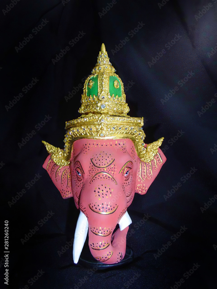 Image of ganesha khon mask in native thai style. A model of thai actor's  Khon mask on black background.(Thai traditional dance) Use in khon thai  classical style of ramayana story. Stock Photo