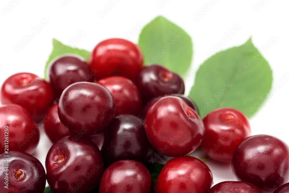 Ripe cherry berries on a white background, close-up Ripe cherry berries on a white background, close-up
