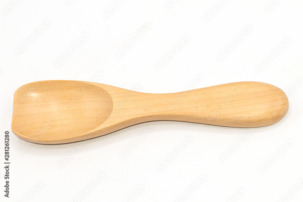Handmade wooden spoon isolated on white background. Handmade wooden spoon isolated on white background.
